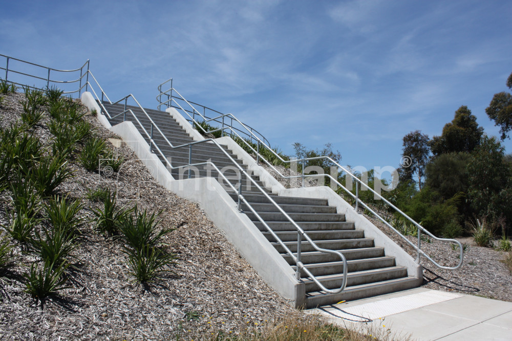 Handrails installed on stairs leading to shared use cycle path